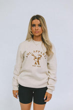 Load image into Gallery viewer, Female model wearing AHL Apparel Natural sweatshirt with brown stag graphic