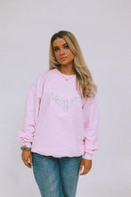 Load image into Gallery viewer, Model wearing AHL Apparel Soft Pink sweatshirt with eagle graphic