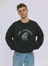 Load image into Gallery viewer, Male model wearing AHL Apparel black oversized sweatshirt with white wolf graphic