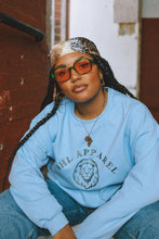 Load image into Gallery viewer, Model wearing AHL Lion Serene Blue graphic sweatshirt