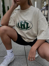 Load image into Gallery viewer, Female model styling AHL Apparel Natural Raw oversized logo T-shirt