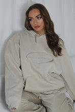 Load image into Gallery viewer, Female on sofa with white background modelling cream tracksuit
