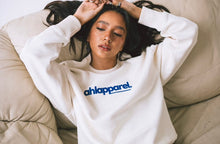 Load image into Gallery viewer, AHL Apparel Natural Raw organic cotton sweatshirt with blue chest logo on model
