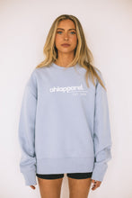 Load image into Gallery viewer, Model wearing AHL Apparel Soul Blue sweatshirt with white logo
