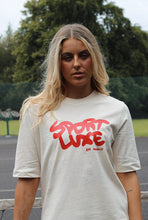Load image into Gallery viewer, AHL Apparel Sports Luxe Natural Raw oversized T-shirt with red graphic
