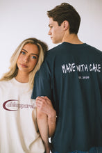 Load image into Gallery viewer, AHL Apparel oversized Indian Ink Grey T-shirt with white front logo on model
