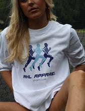 Load image into Gallery viewer, AHL Apparel Sports Luxe oversized white unisex T-shirt with blue runner graphic

