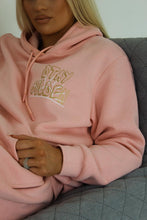 Load image into Gallery viewer, Female lying on sofa modelling pink stay golden tracksuit
