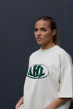 Load image into Gallery viewer, AHL Apparel Natural Raw oversized unisex logo T-shirt styled on model

