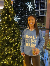 Load image into Gallery viewer, Female standing in front of Christmas trees modelling blue holly jolly babe sweatshirt
