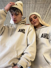 Load image into Gallery viewer, Male and female models styling cream hoodie and beanie
