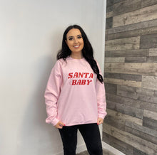 Load image into Gallery viewer, Female wearing pink Santa Baby sweatshirt
